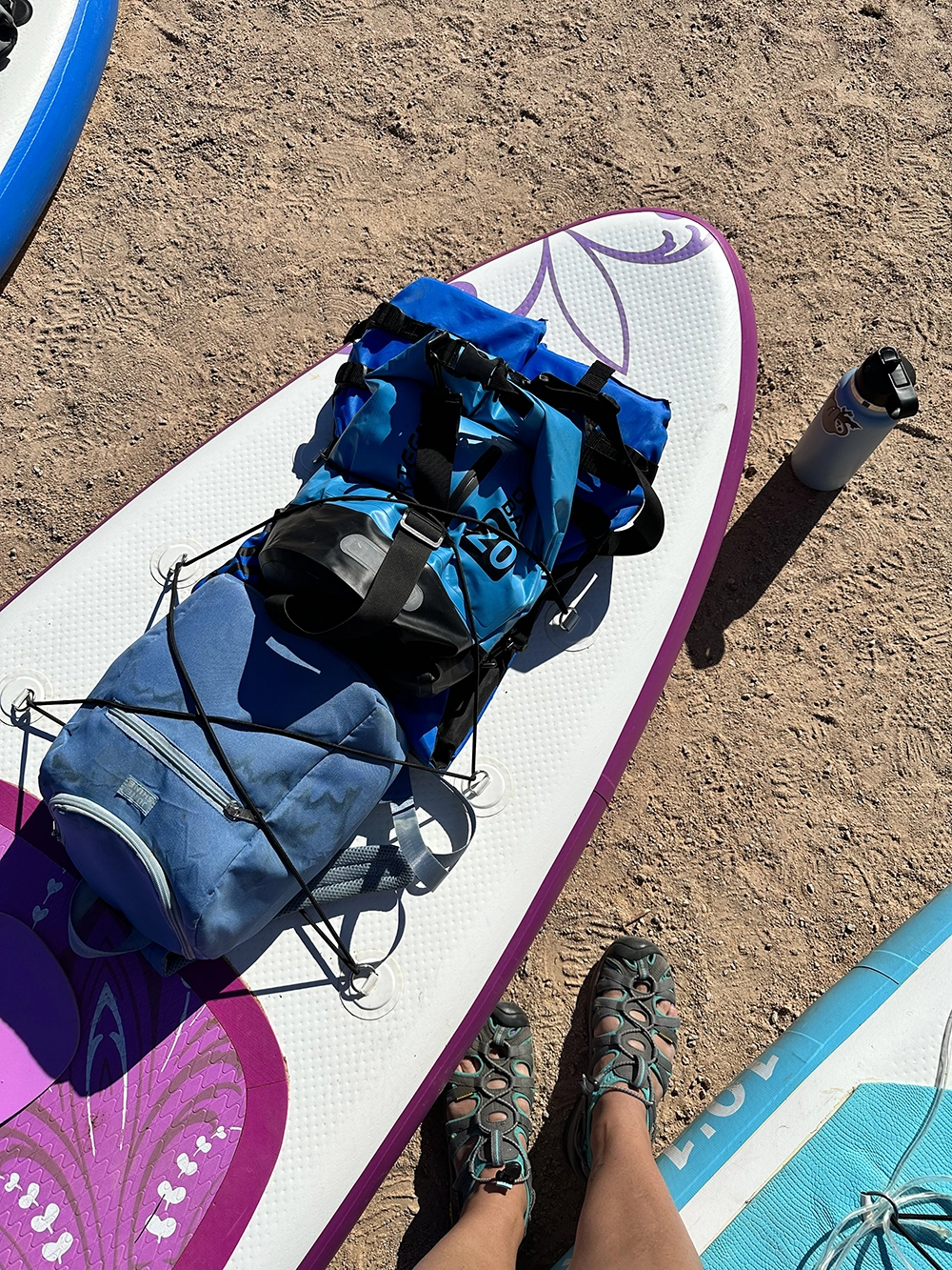 My paddle with a lifevest, cooler, and dry bag. 